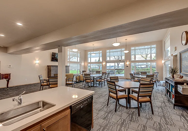 Large Social Room with Fireplace and Kitchen