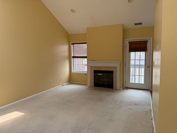 Cathedral Ceiling & Fireplace in Living Room.
