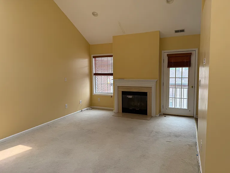 Cathedral Ceiling & Fireplace in Living Room.
