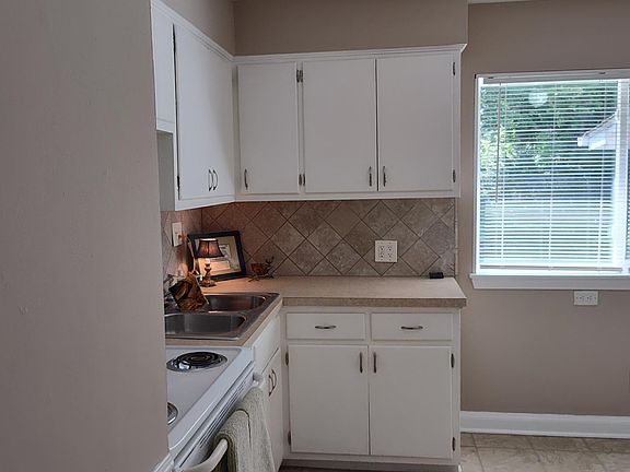 Kitchen with electric stove.