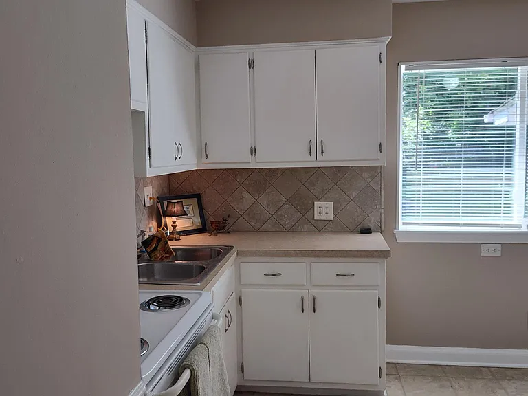 Kitchen with electric stove.