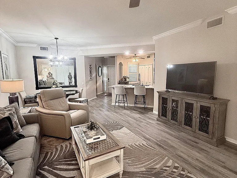 Remodeled living room and furniture; two comfortable leather motion recliners with phone charging port