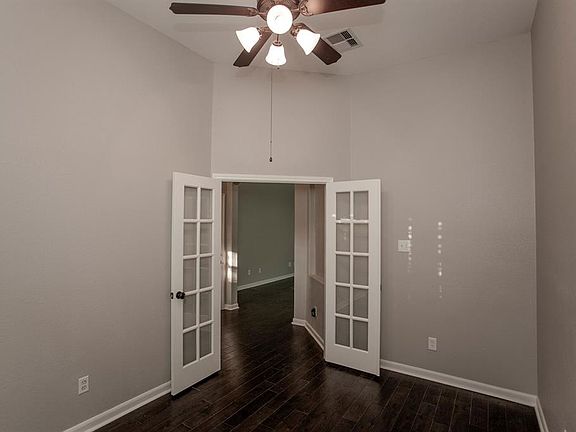 Tall ceilings give the home office a spacious, airy feel...