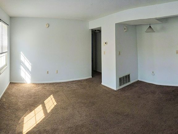 Living room with dining room on right