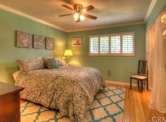 Very generous Master Bedroom boasts one of several ceiling fans found in this home. Window views a s