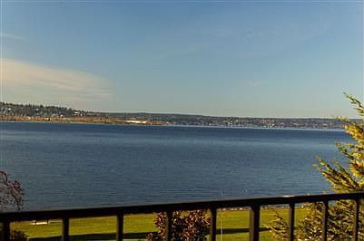 Wraparound view deck off living and dining rooms - takes in wonderful lake views,Seattle lights & Olympics.