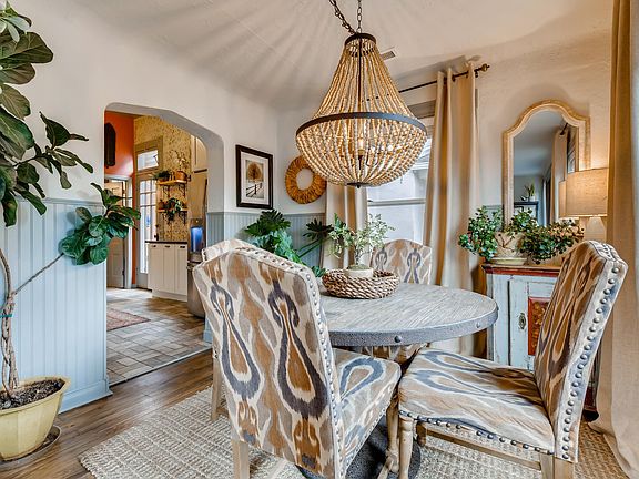 Separate dining, Original wood floors, custom chandelier.