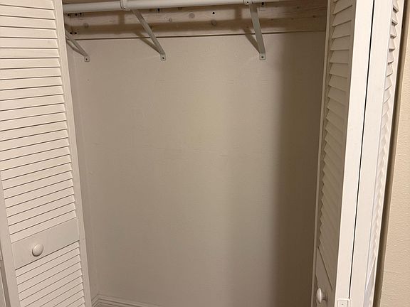 Closet with clothing rod and shelf