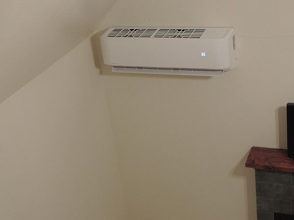 Living room. New 'Mr. Cool' mini-split heating/cooling unit.