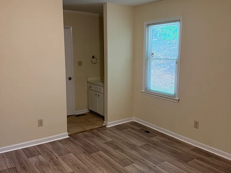 Primary bedroom looking to attached closet & bathroom