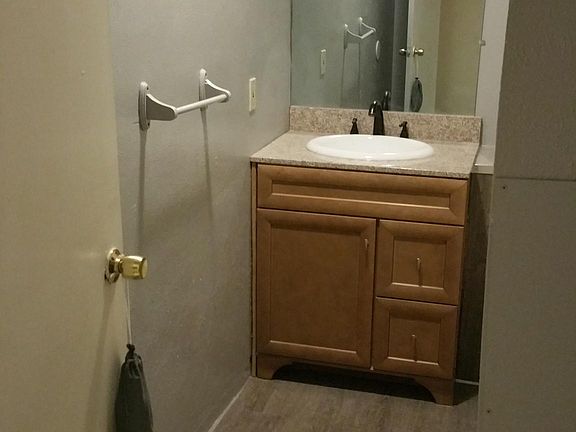 Upstairs full bath with updated vanity, toilet and tub surround