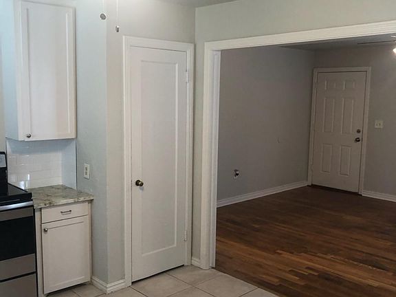 Hardwood floors shined up just for you! Tile in kitchen.
