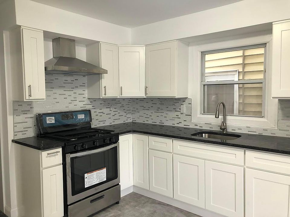 New kitchen with stainless steel appliances