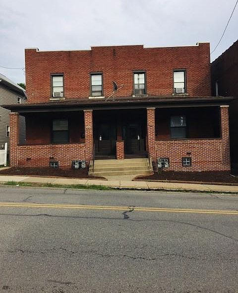 Four unit building. Apartment is on the right side, first floor