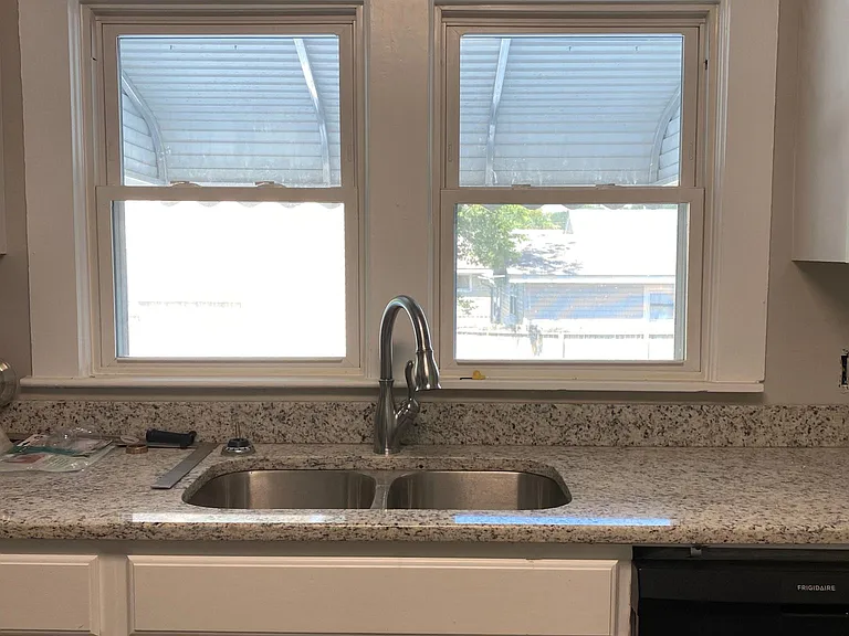 Light floods this totally remodeled kitchen. Window looks out to the private, fenced backyard. Granite, new appliances, dishwasher, dispose-all, microwave, easy care floor, side by side stainless fridge, spacious cabinets, lazy Susan storage, new fixtur