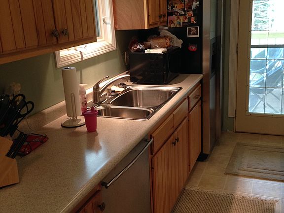 Upper level covered porch and attached garage through door.