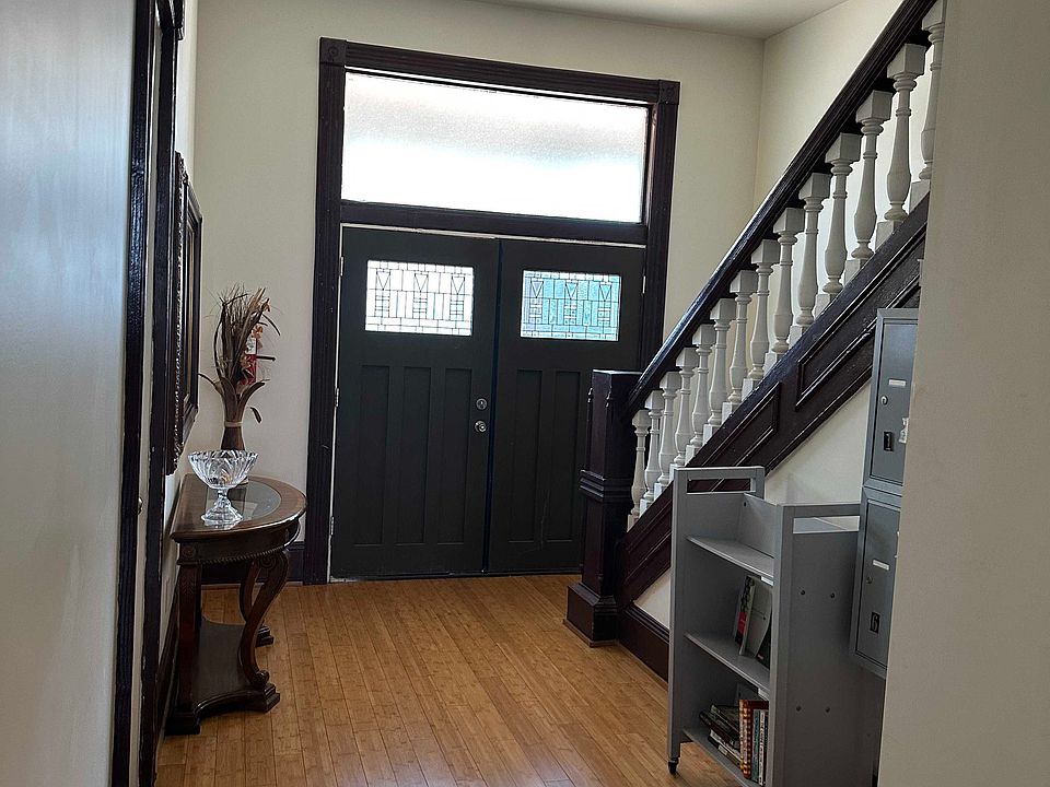 Front Door to Building with Mailboxes and Stairs leading to the 2nd floor.