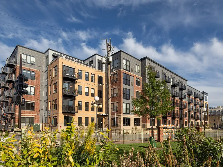 Full outdoor exterior view of The Whitley apartment building in St. Paul, MN.