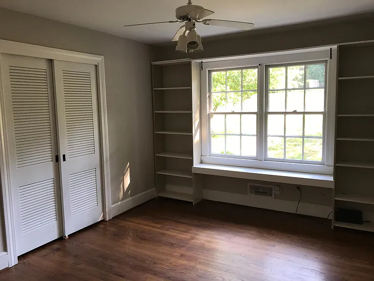 Built-in bookcases in one bedroom.