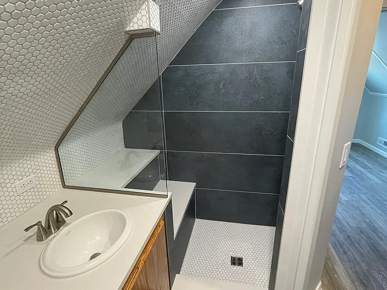 Upstairs bathroom shower with bench