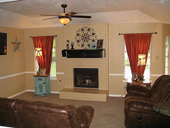 Spacious living area with gas log fireplace