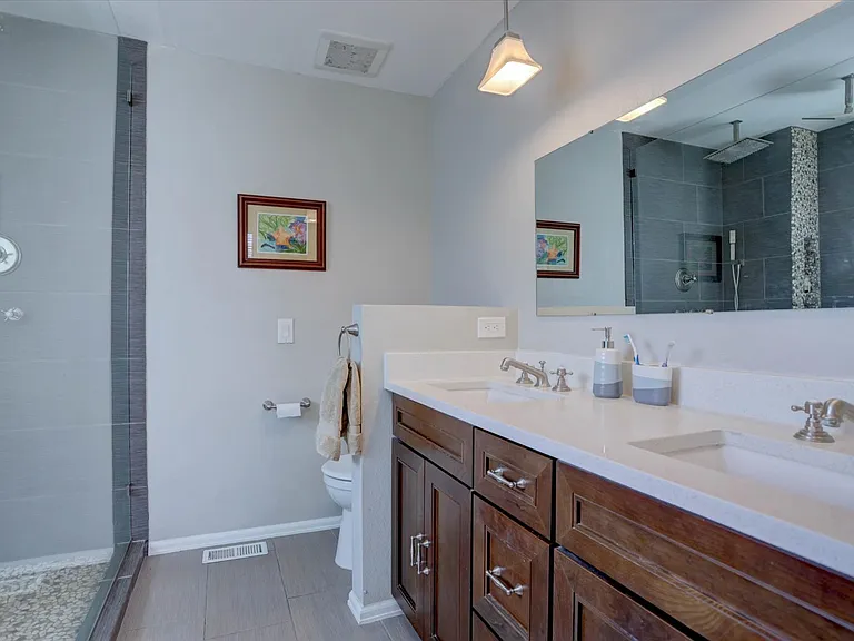 updated primary bathroom with dual sinks