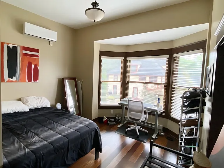 The large bedroom features a built-in California closet