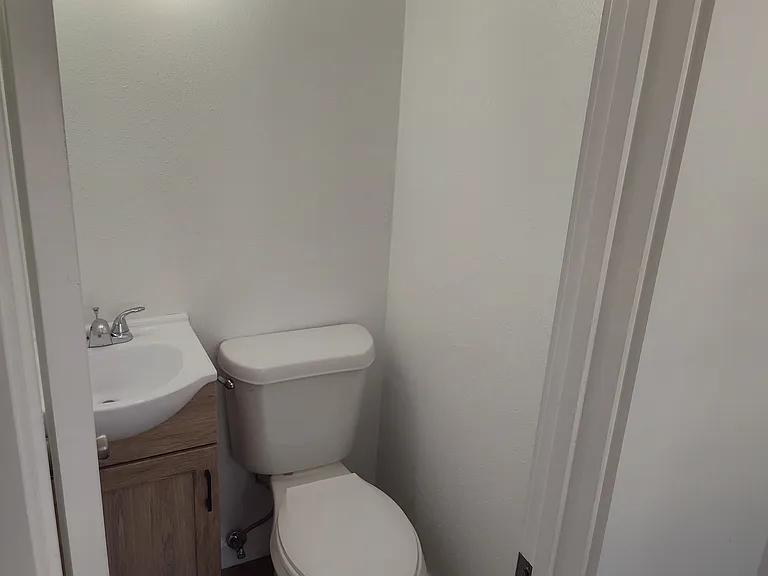 1/2 half bathroom downstairs by the backdoor.