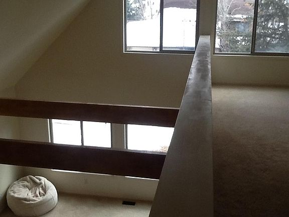 Bright second story loft overlooking living room.