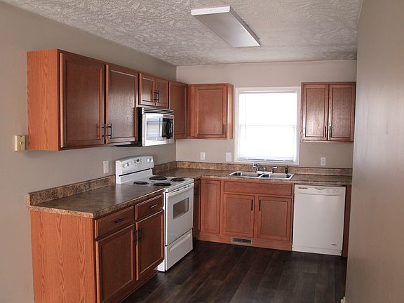Kitchen--includes range, microwave, garbage disposal, dishwasher, refrigerator