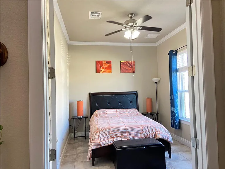 Bedroom 2/Office on first floor. Small closet or office storage in the room.