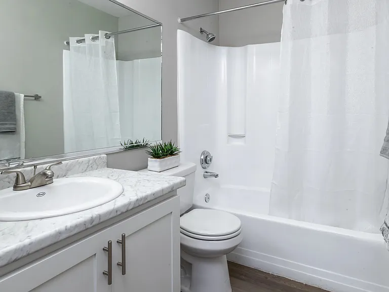 Lavish bathrooms renovated to perfection, featuring new countertops and cabinetry.