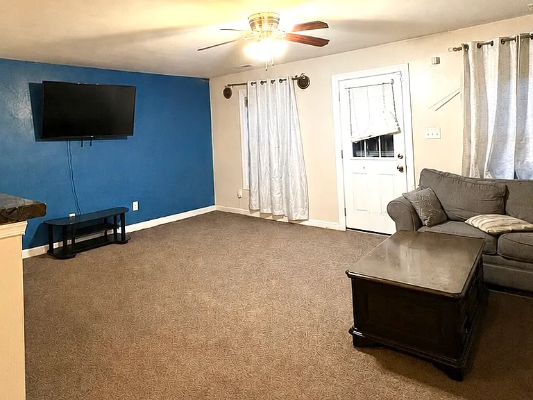 Living room with door to back patio