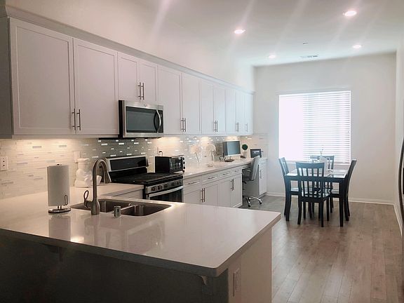Quartz countertop, full backsplash and all Whirlpool appliances.