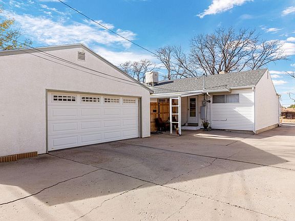 view of back of property and door entry to unit B.