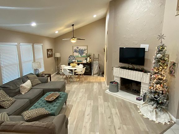 Living room with wood burning fireplace