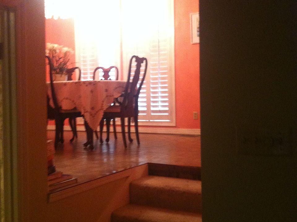 View from living room looking up into dining room