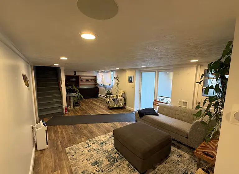 Extended lower-level layout offering multiple seating areas and flexible use of space.