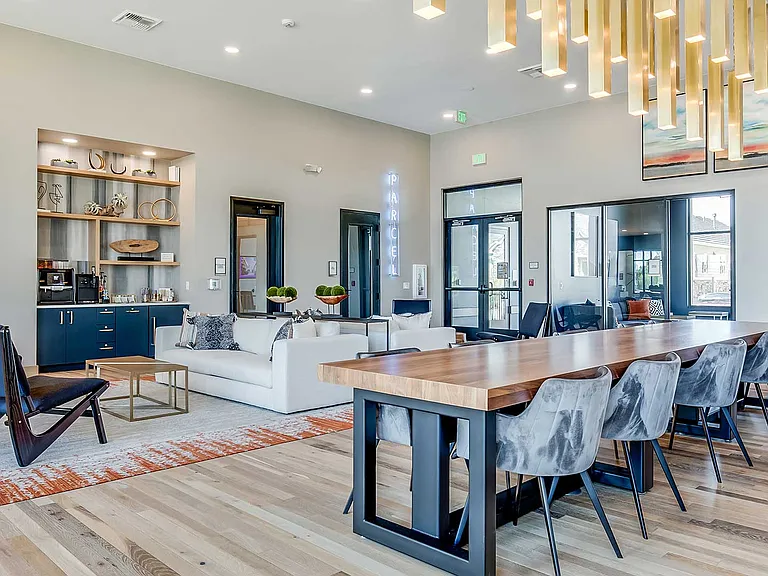 The resident lounge at The Wright features comfortable seating, collaborative gathering spaces, and a welcoming atmosphere designed for relaxing, socializing, or casual remote work.