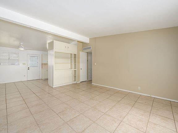 Living Room, built in cabinet and kitchen entry