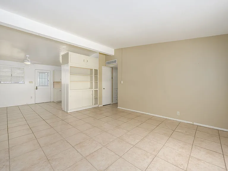 Living Room, built in cabinet and kitchen entry
