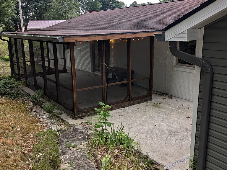View of back patio/lounge area from backyard