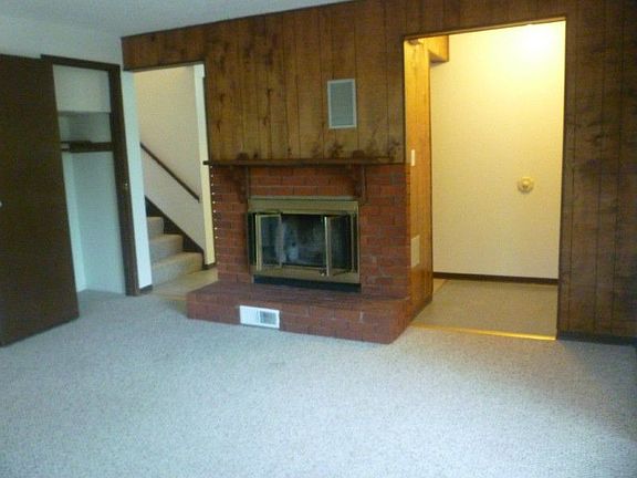 Nice sized living room featuring the fireplace-home has a separate entry way as well-has a country f
