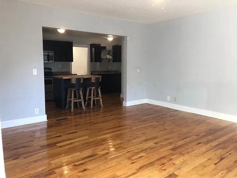 Spacious living area with natural hardwoods