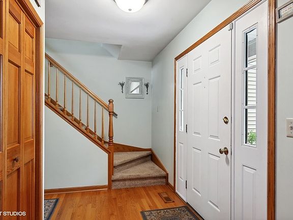 Inviting foyer with closet and hardwood floors!