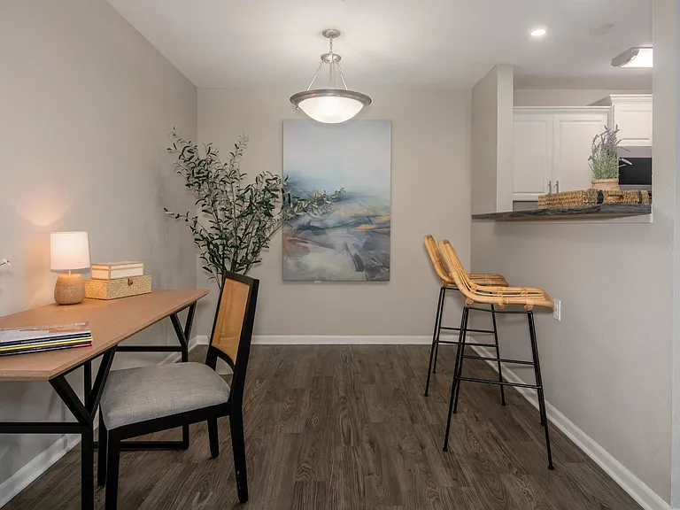 Our one-bedroom floor plan offers a dedicated office workspace, featuring sleek wood-like floors and ample space for productivity.