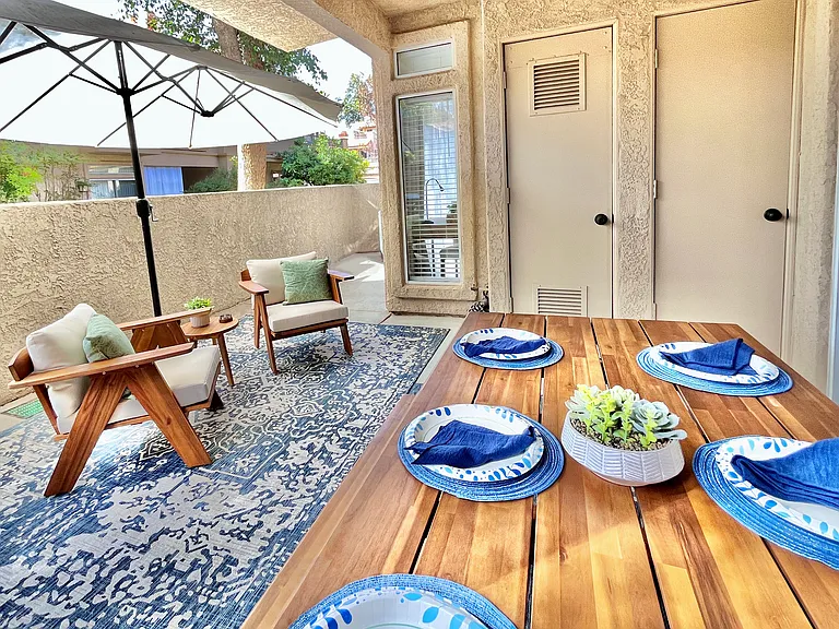 Dine in style at the outdoor dining area for six, featuring a chic table and comfortable seating perfect for alfresco meals, entertaining, or enjoying the serene surroundings.