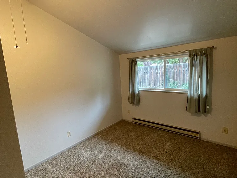 Bedroom one also has high ceilings.