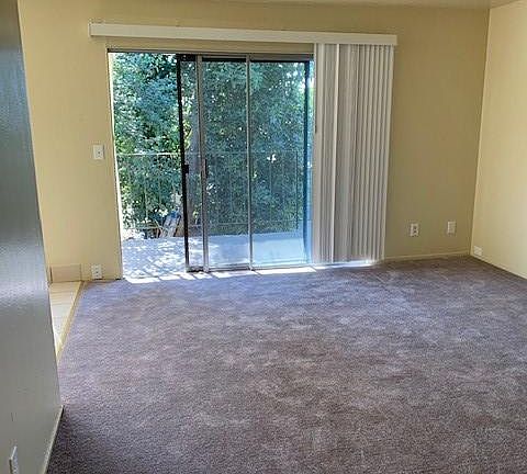 Living room with outdoor deck access