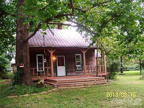 Log looking bungalow, but bigger than it looks from the outside.